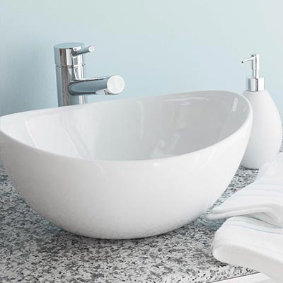 Above counter mounted vessel bathroom sink